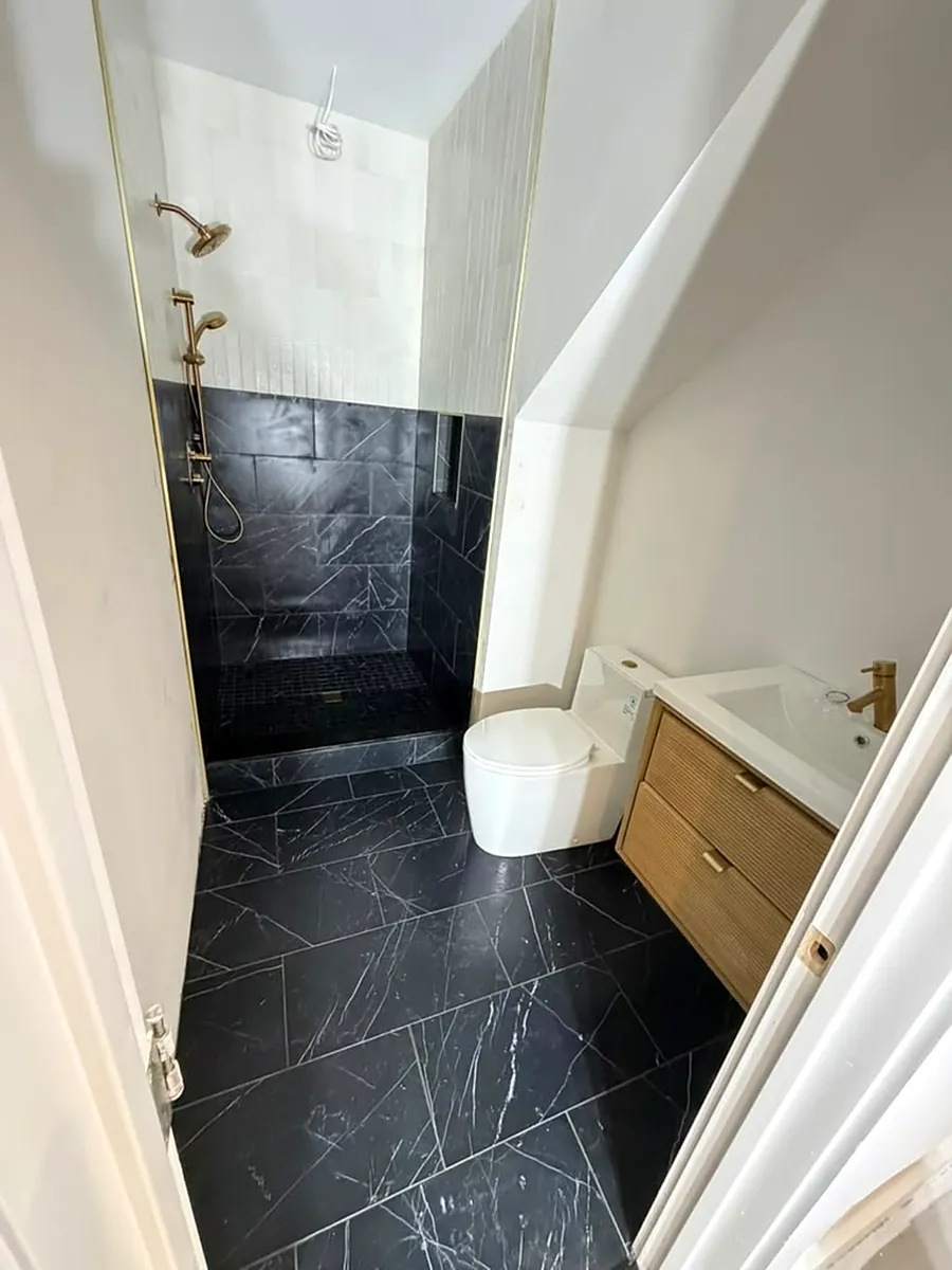 Marble floor and wainscot, brass fixtures