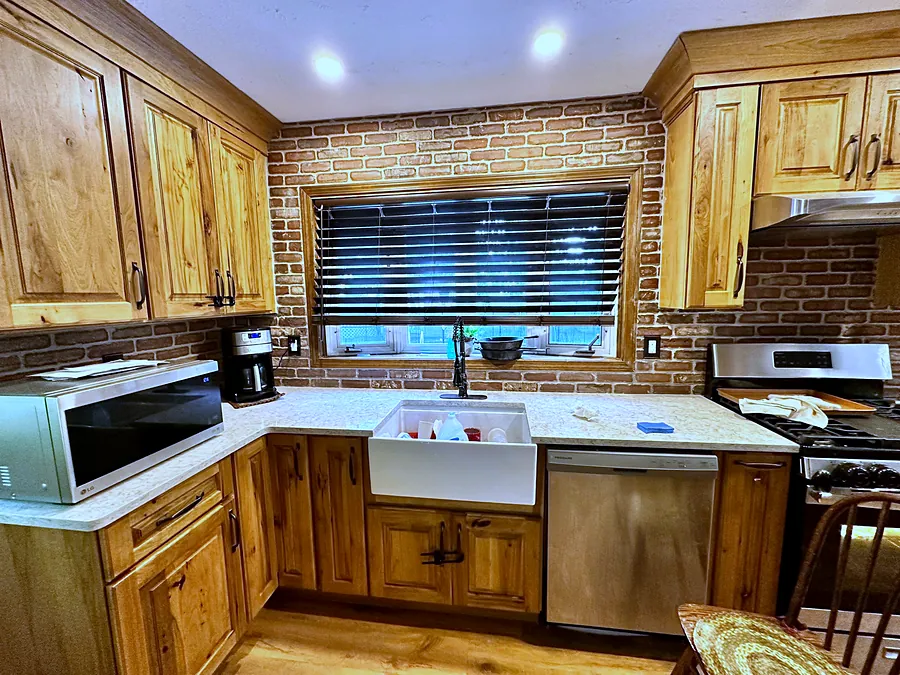 Brick wrapping the full kitchen wall