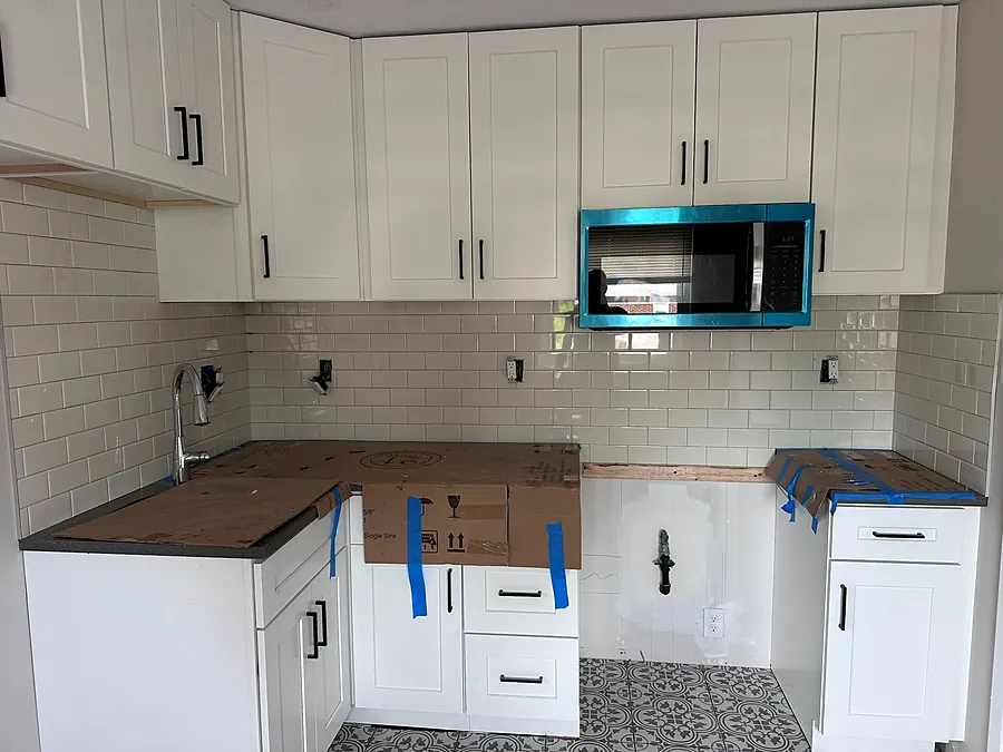 New cabinets, tile floor and backsplash
